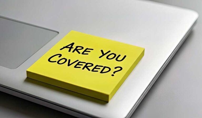 A person reviews a health insurance policy document at home, with herbal supplements and acupuncture needles nearby.